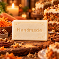 Carrot Cake shea butter soap, a single Handmade embossed bar with a fragrance-inspired background