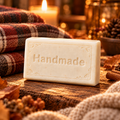 Cozy Flannel 4 oz handmade shea butter soap with fragrance-inspired background