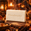 Enchanted Ember 4 oz handmade shea butter soap with fragrance-inspired background