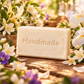 Honeysuckle Jasmine Howl + Ember shea butter soap with engraved Handmade lettering and a scent-inspired background
