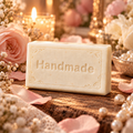 Petal + Pearl 4 oz handmade shea butter soap with scent-inspired background