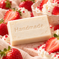 Strawberries & Cream handmade 4 oz shea butter soap bar in fragrance-inspired setting